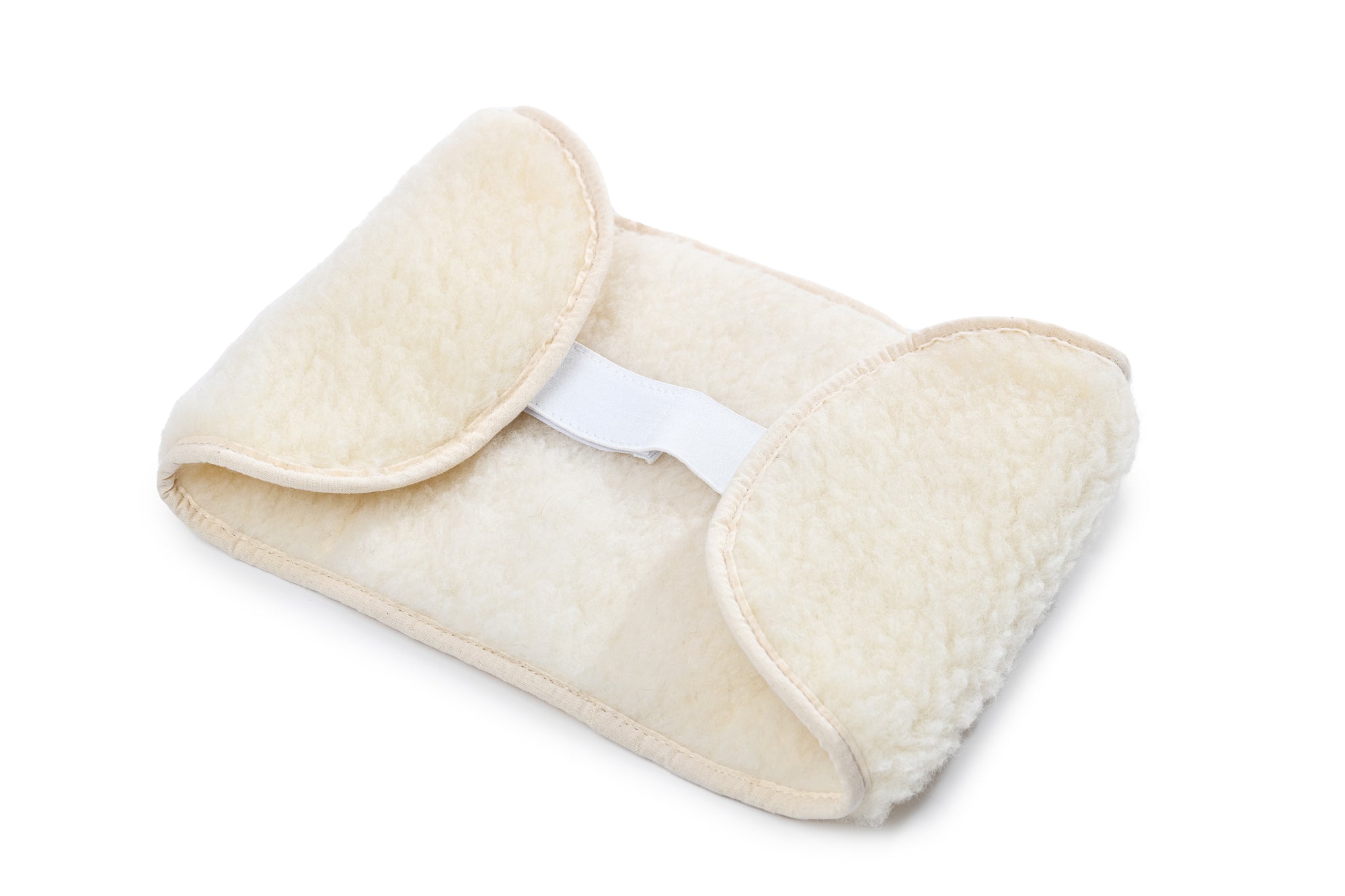 Der wärmende Rückengurt aus Schafwolle von Wool-Line auf weißem Untergrund. In der Mitte befindet sich ein weißer Klettverschluss, der den Rückengurt sicher am Körper hält ohne zu kratzen.